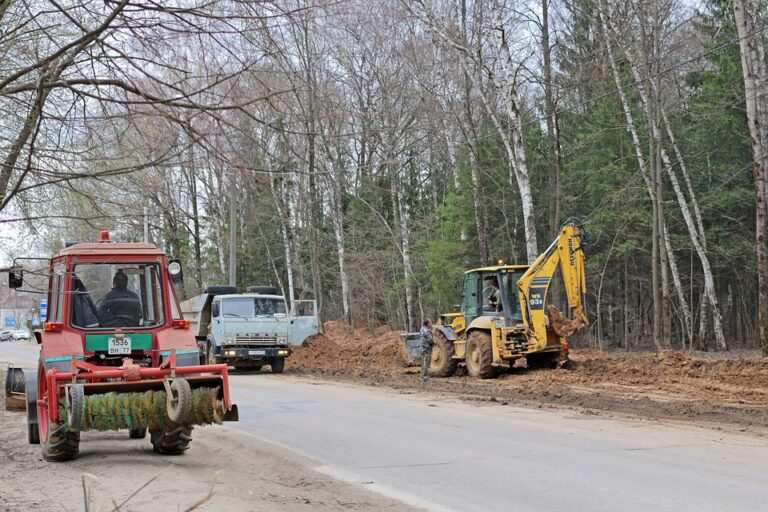 Construction-machinery-excavating on-the-side-of-a-road