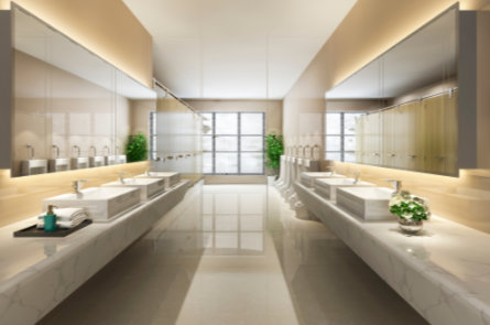 Modern commercial restroom interior showing sinks and stalls, emphasizing reliable drain cleaning services.