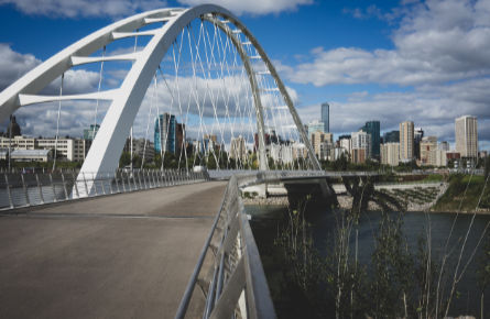 Walterdale suspension bridge and Saskatchewan river with skyline in Edmonton Alberta Canada